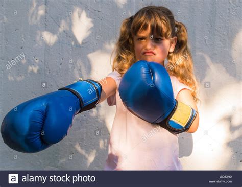 Little Girl Wearing Blue Boxing Gloves Stock Photo Alamy