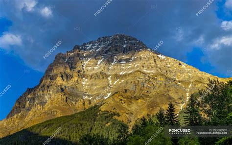 Rugged Mountain In The Canadian Rocky Mountains Illuminated By Sunlight