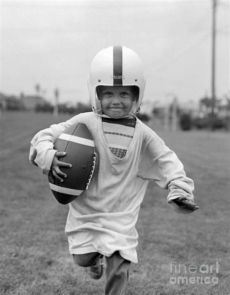 Boy With Oversized Football Gear 1950s Photograph By H Lefebvre
