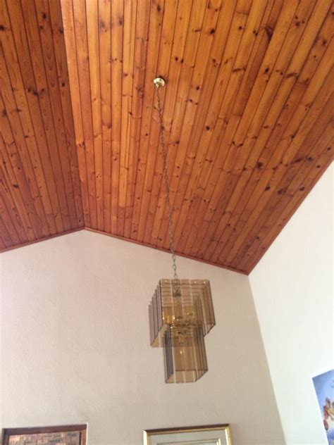 If you're looking for something a little more contemporary, though, it's fine to just paint over it. How to: Painting of Pine and Varnished Ceilings - Jenny Heron