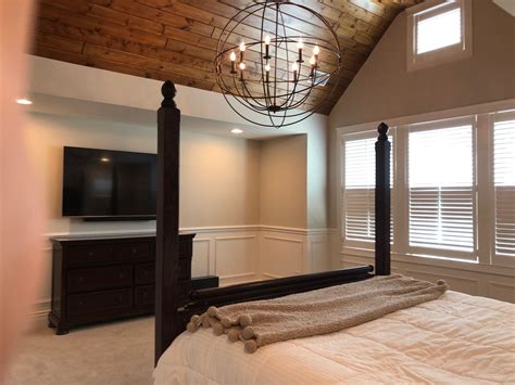 Who Wouldnt Love To Relax In This Cozy Bedroom The Wood Ceilings And