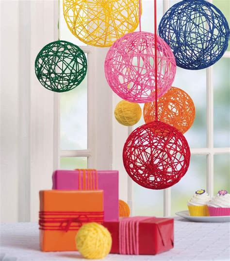 This creative diy baby shower balloon idea is such a cute idea! Hanging Yarn Balls - JoAnn | Jo-Ann | Yarn ball, Yarn ...