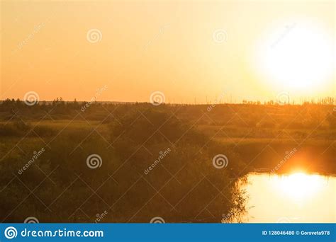 The Setting Sun Is Reflected In The River Stock Photo Image Of Water