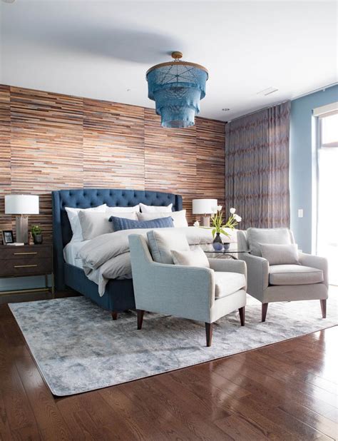 Spacious Master Bedroom With Jute Accent Wall And Navy Headboard Blue