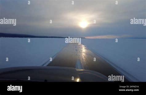 Driving On Ice Road Of Lake Baikal Stock Video Footage Alamy