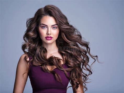 Face Of A Beautiful Woman With Long Brown Curly Hair Fashion Model