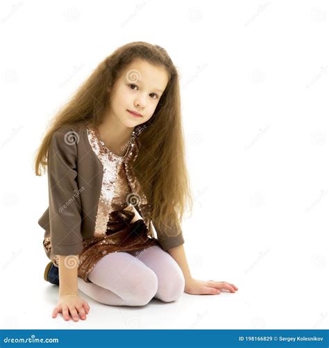 Beautiful Girl Wearing Fashionable Dress Sitting On The Floor On Her Knees Stock Image Image