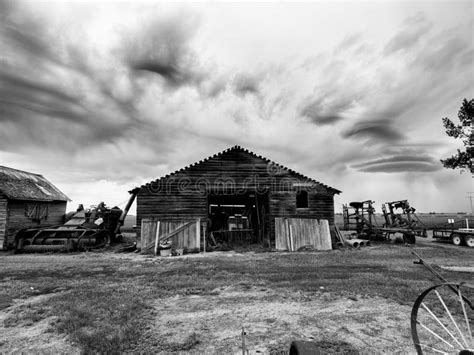 Black And White Farm Storage House With Vivid Rain Skies Background