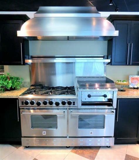 In the kitchen, had a 36 cobalt blue rnb range, all burners, meile dishwasher, bosch 36' counterdepth fridge, faber hood and sharp microwave drawer. A BlueStar Heritage Classic Range with a BlueStar Wall ...