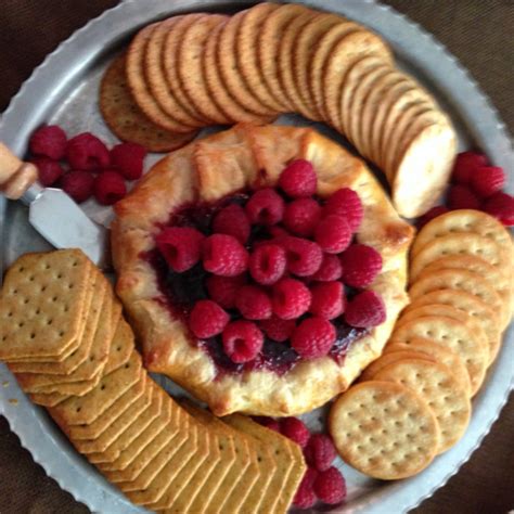 Roll puff pastry out slightly. Baked Brie with Fig Jam in Pastry a Puff