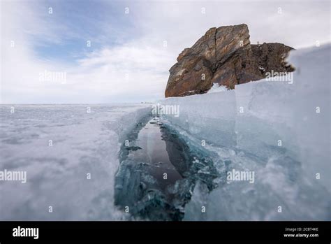 Ice Crack On Frozen Surface Of Lake Baikal Russia Stock Photo Alamy