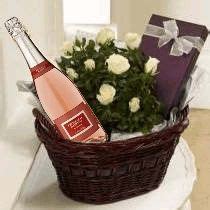 My daughters loved the early easter gifts. Bottle of wine, white roses & a box of Chocolates! | Cesta ...
