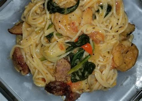 Simple shrimp scampi served over angel hair pasta. Shrimp and sausage w/Angel hair pasta in a Cajun cream ...
