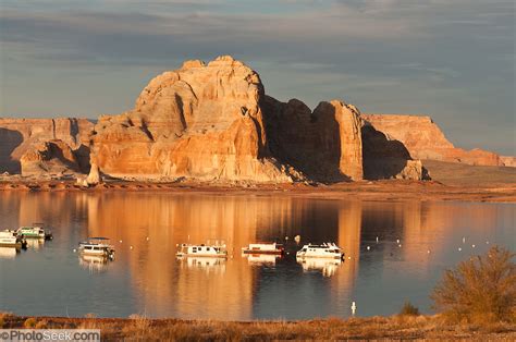 Sunset Illuminates Sandstone And Houseboats At Sunset On Lake Powell