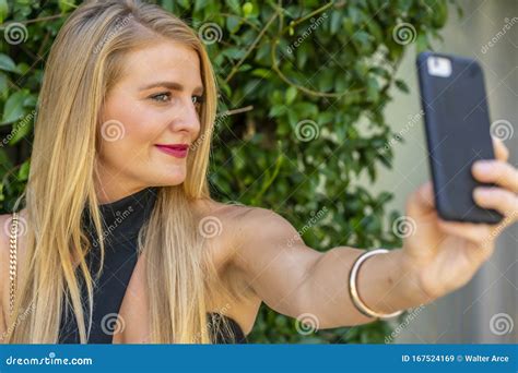 A Lovely Blonde Model Enjoys A Summers Day Outdoors At The Park Stock Image Image Of Feminine