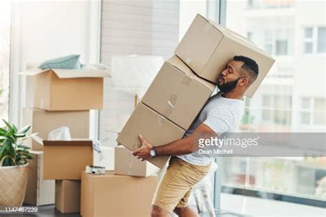 Black Guy Moving Boxes Photos And Premium High Res Pictures Getty Images