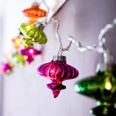Colorful Glass Ornaments Hanging From A Wall