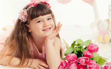 Cute Smiley Little Girl Is Holding Face With Hands Wearing Pink Dress