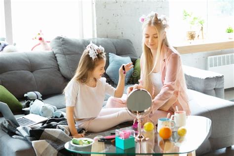 Mother And Daughter Sisters Have Quite Beauty And Fun Day Together At Home Comfort And