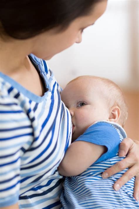 Baby Feeds On Mother S Breasts Milk Stock Photo Image Of Innocence