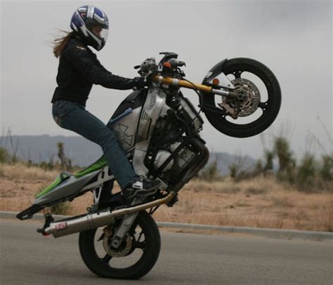 i don t see a lot of pics of girls doing wheelies nice one riding motorcycle motorcycle
