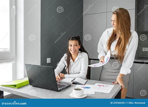 Two Women Work In The Office Business Partners Happy People At Work