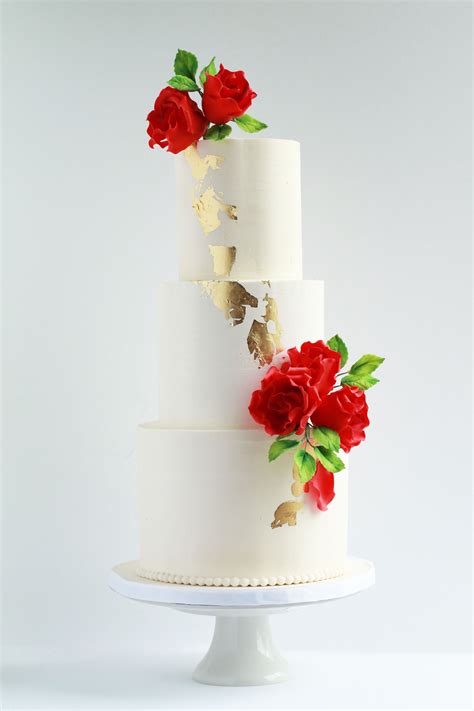 Simple with white flowers simple and chic buttercream wedding cakes . White buttercream wedding cake with gold foil and red ...
