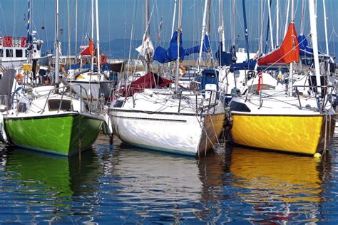 Sailing Boats Of Various Colors Moored Stock Photo Image Of Moored