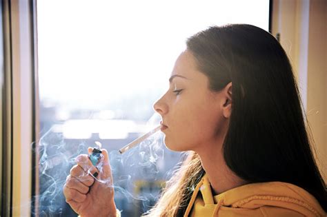 Beautiful Attractive Girl Smoking A Cigarette At The Window Pretty