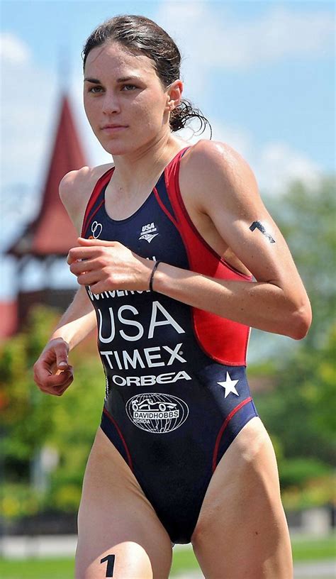 A Woman Running In A Race Wearing A Usa Timex Swimsuit