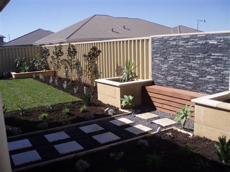 White window boxes with minimalist floral decoration. Top 10 Landscaping Ideas for Your Home