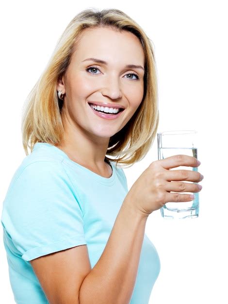 Free Photo The Young Woman Holds A Glass With Water