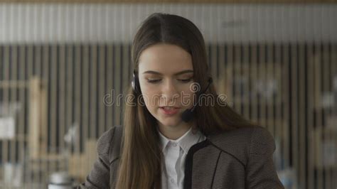 Young Operator Woman Agent With Headsets Working In A Call Centre