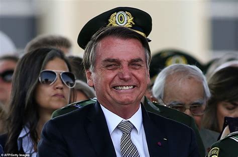 Jair Bolsonaro Jokes Around As He Receives Military Honours While The