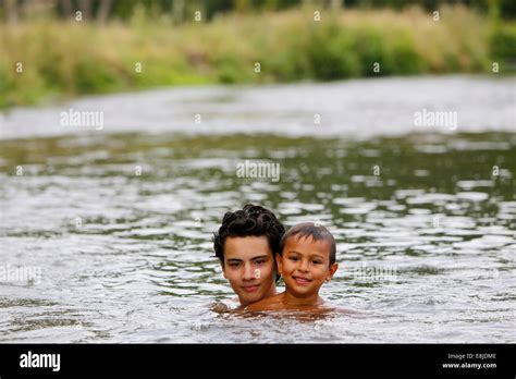 Boys Bathing In A River Stock Photo Alamy