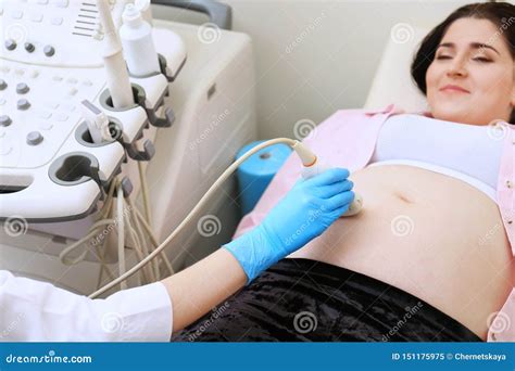 Young Pregnant Woman Undergoing Ultrasound Scan Stock Image Image Of Motherhood Clinic 151175975