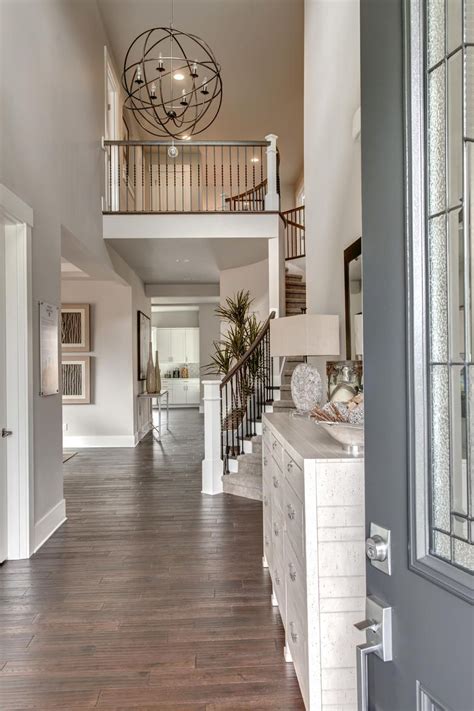 Assembling this dining room chandelier, adjusting the. The Rosario's spacious Two Story Foyer with an Elegant ...