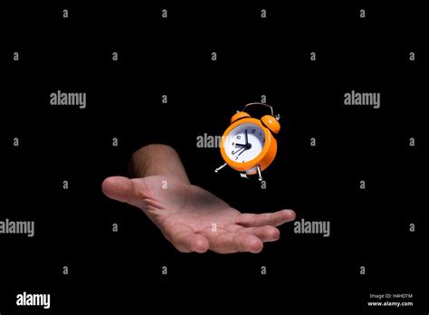 Floating Clock Over The Humans Hand Stock Photo Alamy