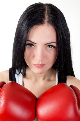 Portrait Of A Beautiful Brunette Girl In Red Boxing Gloves Stock Photo