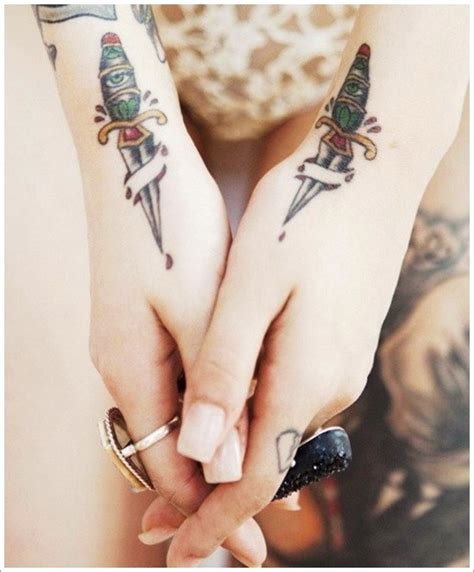 daggers pierces skin tattoo on wrist tattooimages