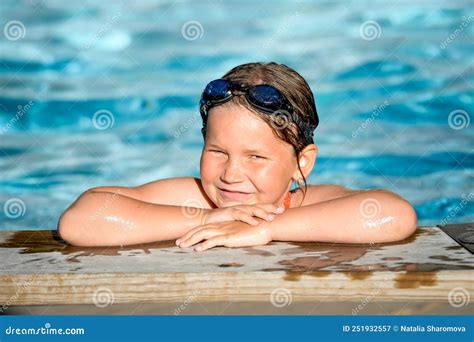Pretty Little Girl In Outdoors Swimming Pool In Summer Vacation Happy