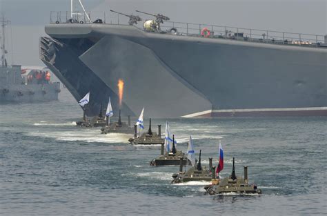 Russian Amphibious Vehicles Drive In Formation During Celebrations To Mark Navy Day In The Far