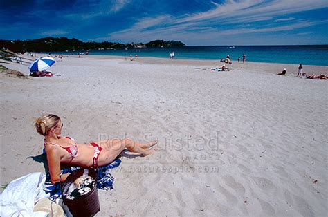 Woman Sunbathing And People Enjoying Summer At Onetangi Beach Waiheke Island Waiheke Island