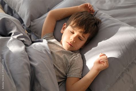 Cute Little Boy Sleeping In Bed At Home Stock Photo Adobe Stock