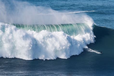 Hurricane Generated Swell Draws Big Wave Surfers To Portugals Nazare