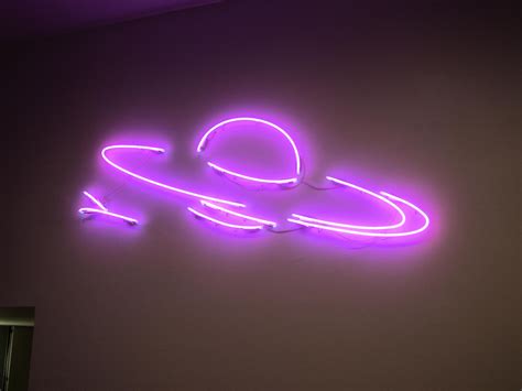 A Neon Sign That Is On The Wall