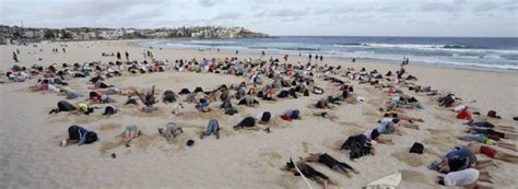 Heads Buried In Sand For G20 Climate Protest At Bondi