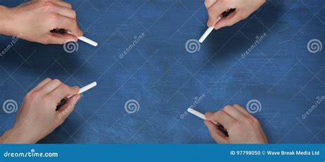 Composite Image Of Multiple Hands Writing With Chalk Stock Photo