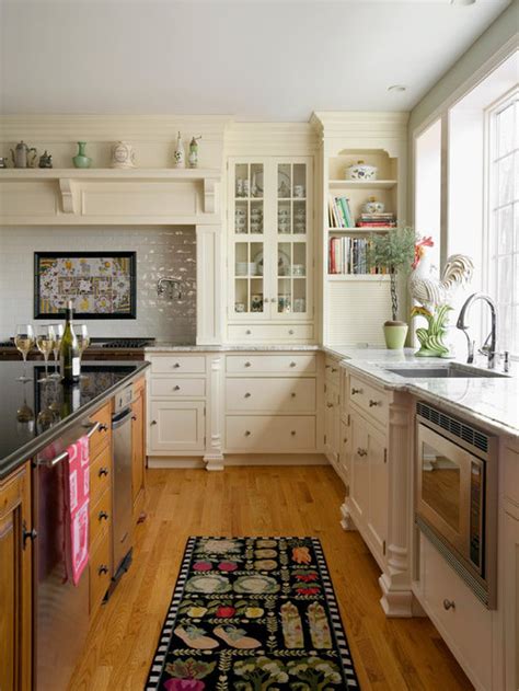 Similar style of kitchen design with some smaller cupboards with lighting for display above functional cupboards. Off White Kitchen | Houzz