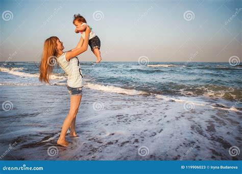 Happy Mother And Small Daughter Playing Together At Beach Mom I Stock Image Image Of Outside